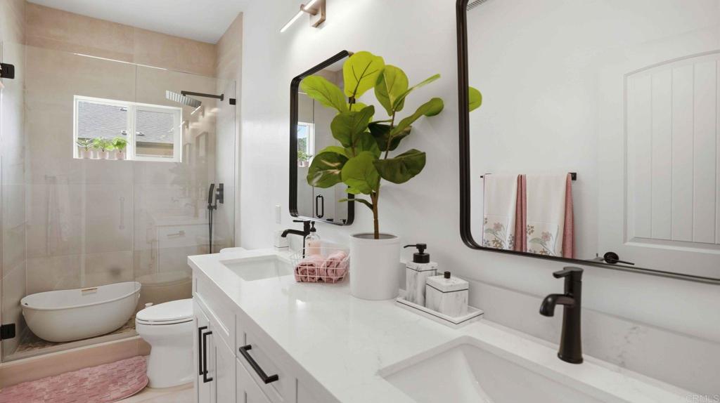 9391 Los Coches Road Lakeside, CA 92040 - Photo 38 of 65 a bathroom with a toilet sink and mirror