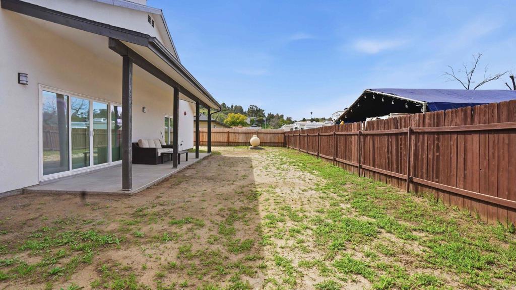 9391 Los Coches Road Lakeside, CA 92040 - Photo 50 of 65 a view of a backyard with wooden fence