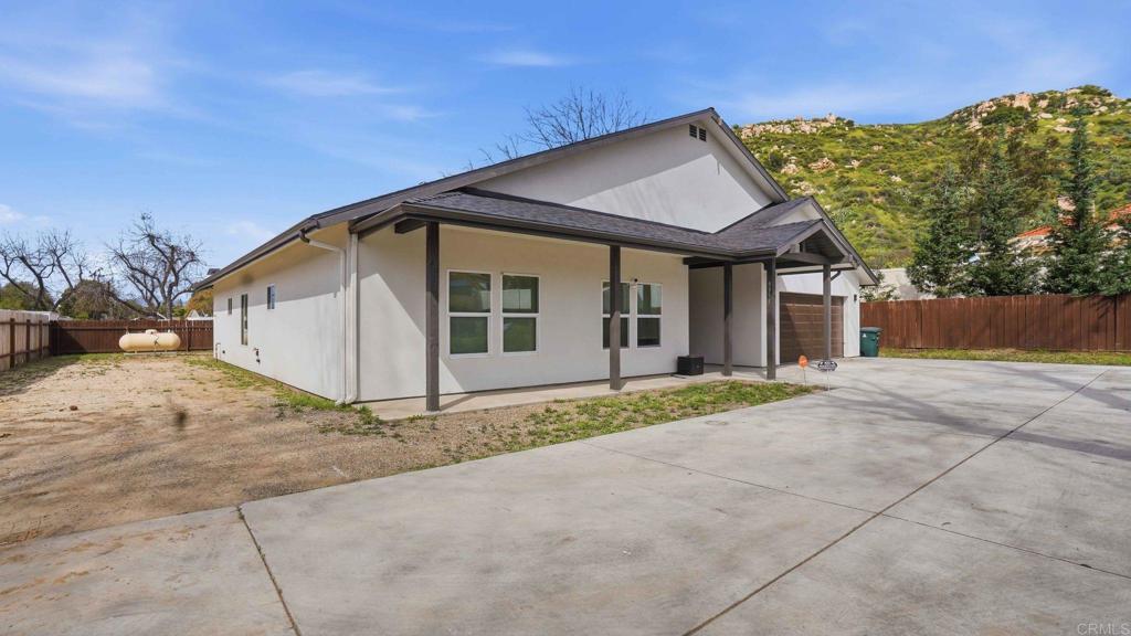 9391 Los Coches Road Lakeside, CA 92040 - Photo 55 of 65 a view of a house with a yard