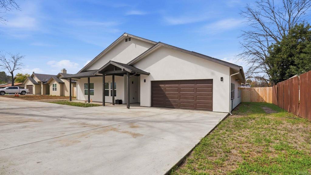 9391 Los Coches Road Lakeside, CA 92040 - Photo 57 of 65 a front view of a house with garden