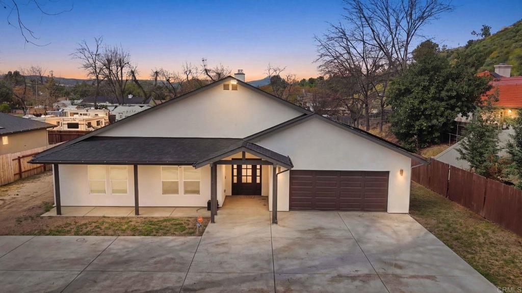 9391 Los Coches Road Lakeside, CA 92040 - Photo 60 of 65 a front view of a house with a yard and garage