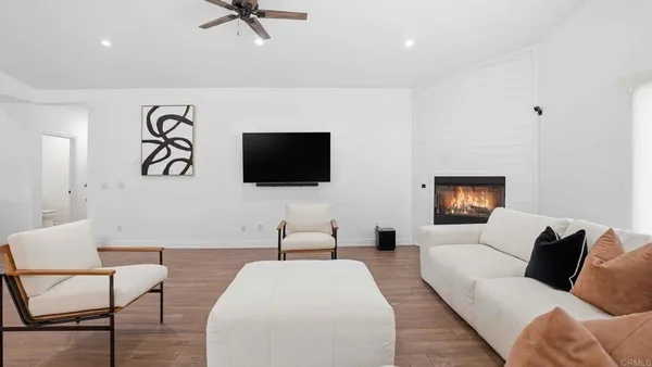 a large bedroom with a large bed and a large window