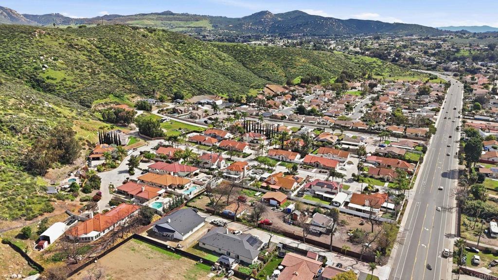 9391 Los Coches Road Lakeside, CA 92040 - Photo 64 of 65 an aerial view of residential houses with outdoor space and trees