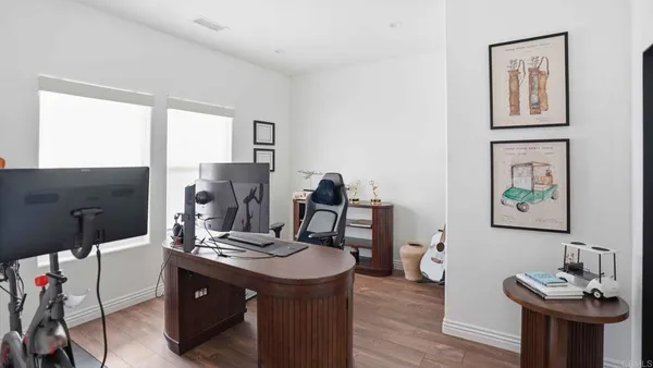 a bedroom with a bed and a television