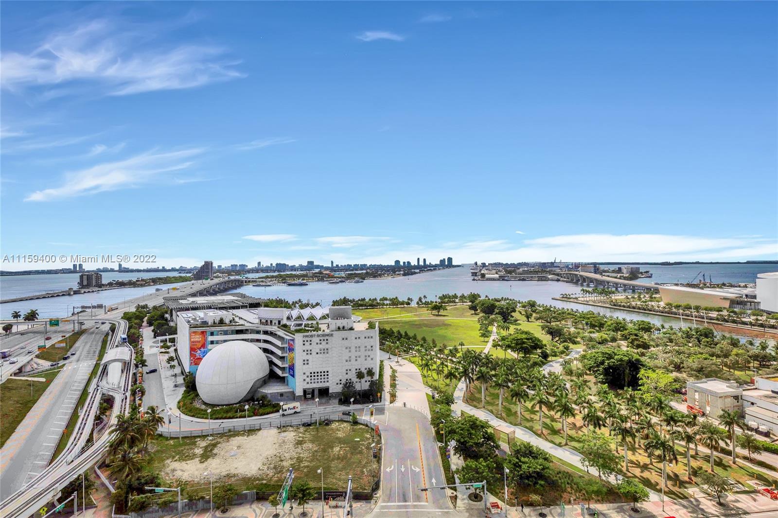 1100 Biscayne Boulevard, Unit 1801 Miami, FL 33132 - Photo 14 of 27 a view of a swimming pool and an ocean view