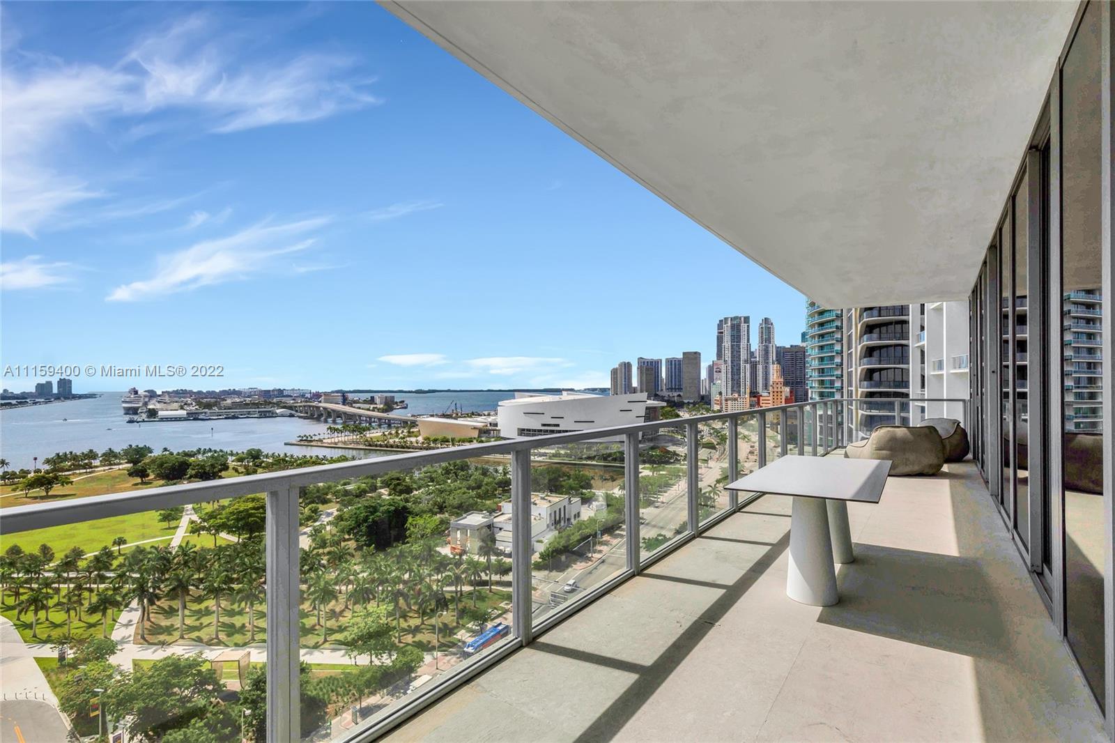 1100 Biscayne Boulevard, Unit 1801 Miami, FL 33132 - Photo 15 of 27 a view of a city from a balcony with seating space