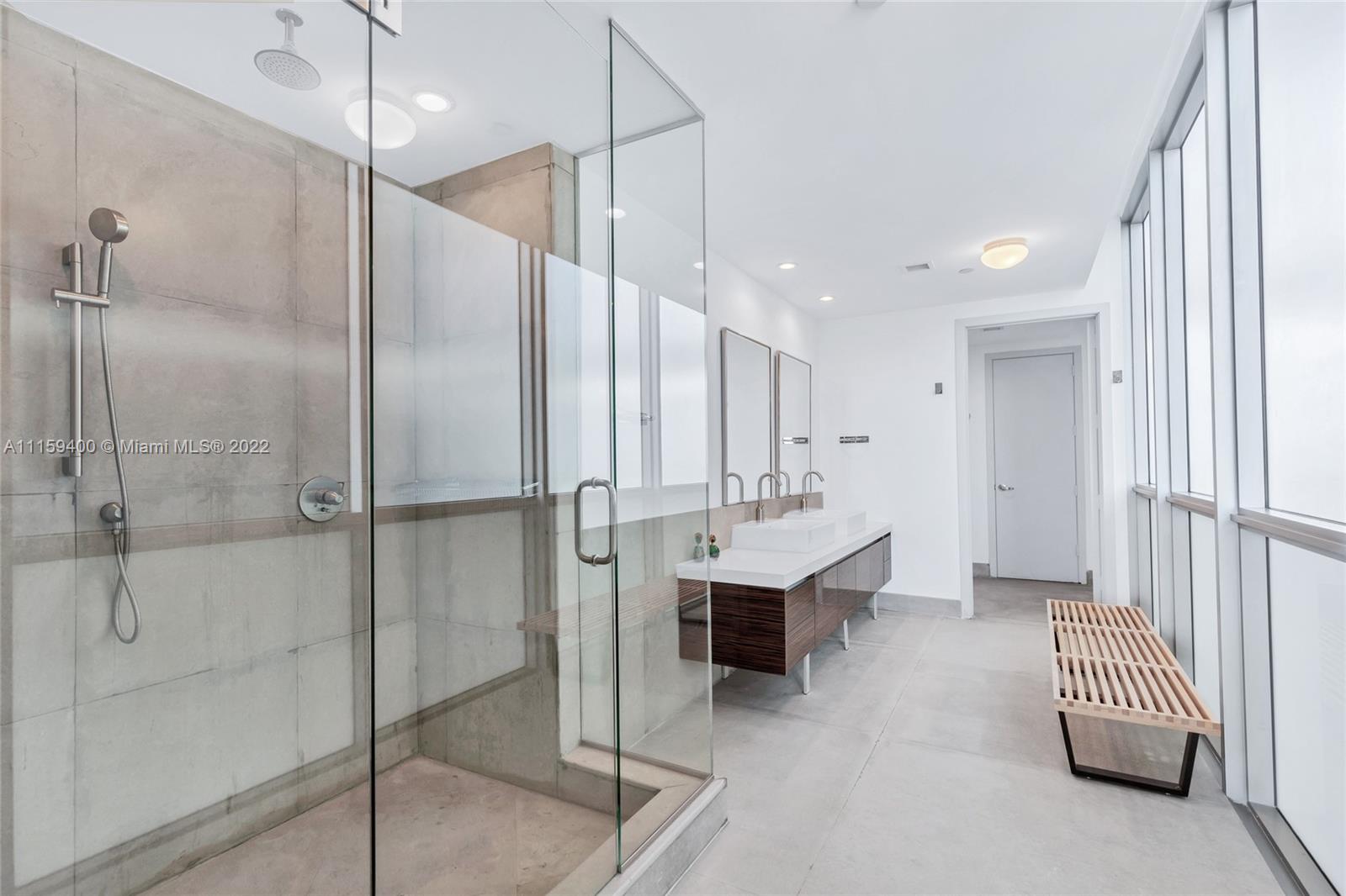 1100 Biscayne Boulevard, Unit 1801 Miami, FL 33132 - Photo 19 of 27 a bathroom with a sink and mirror