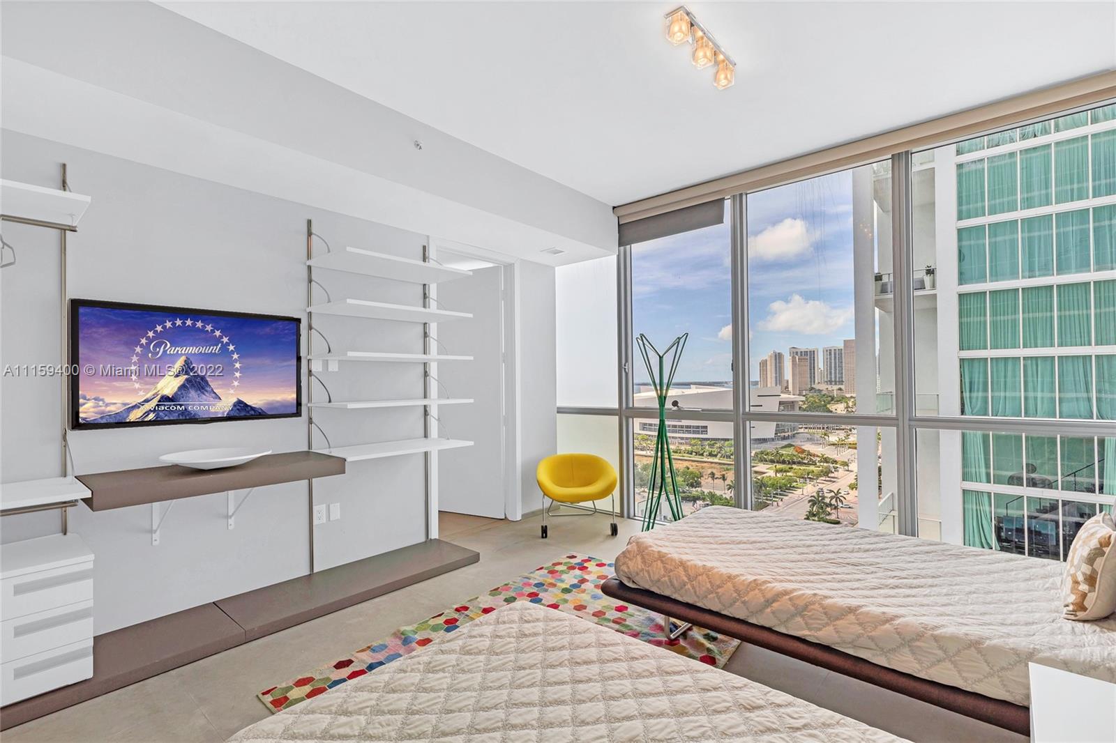 1100 Biscayne Boulevard, Unit 1801 Miami, FL 33132 - Photo 20 of 27 a bedroom with a bed and a large window