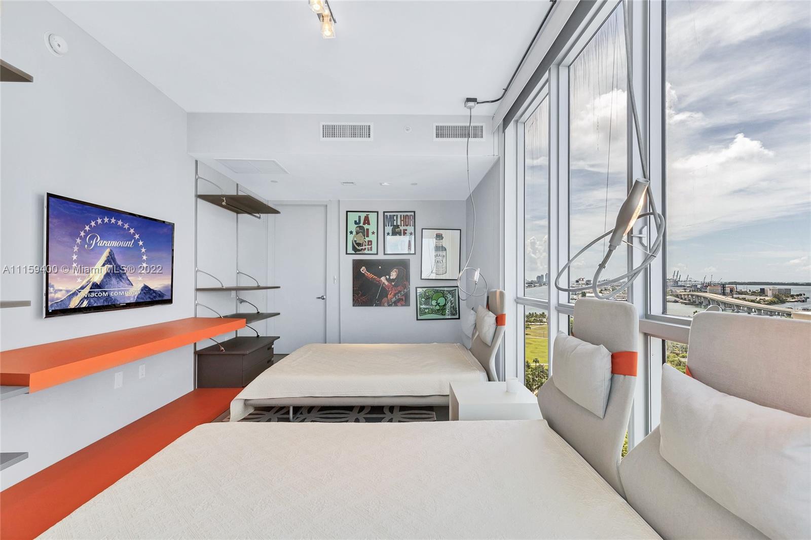 1100 Biscayne Boulevard, Unit 1801 Miami, FL 33132 - Photo 22 of 27 a bedroom with furniture and a large window