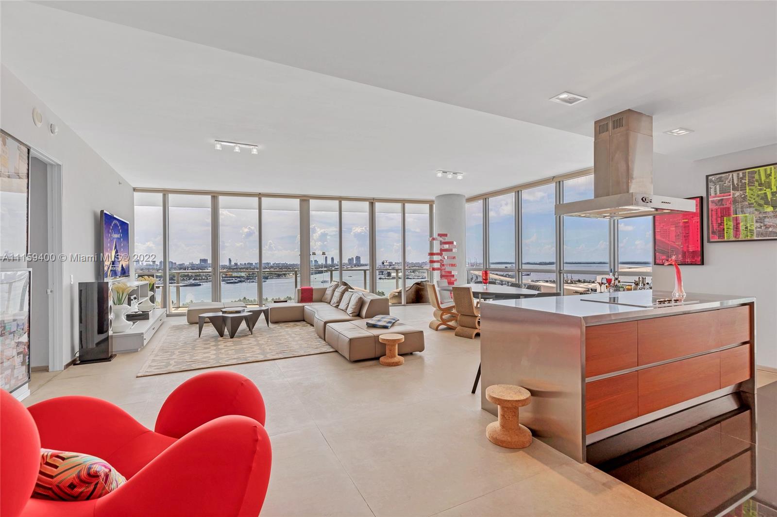 1100 Biscayne Boulevard, Unit 1801 Miami, FL 33132 - Photo 4 of 27 a living room with furniture and a large window