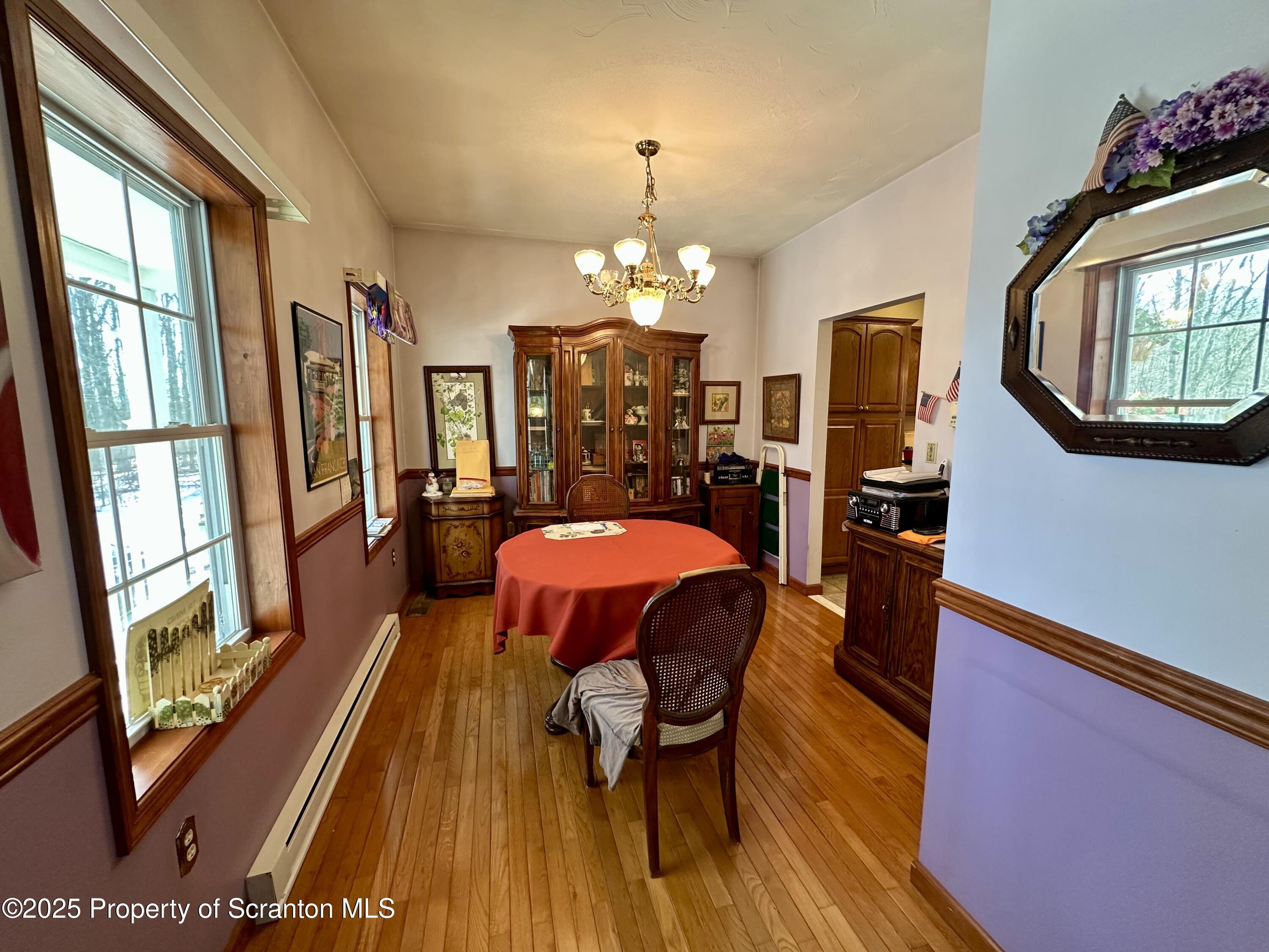 505 Cortez Road Lake Ariel, PA 18436 - Photo 3 of 20 a view of a dining room with furniture window and wooden floor