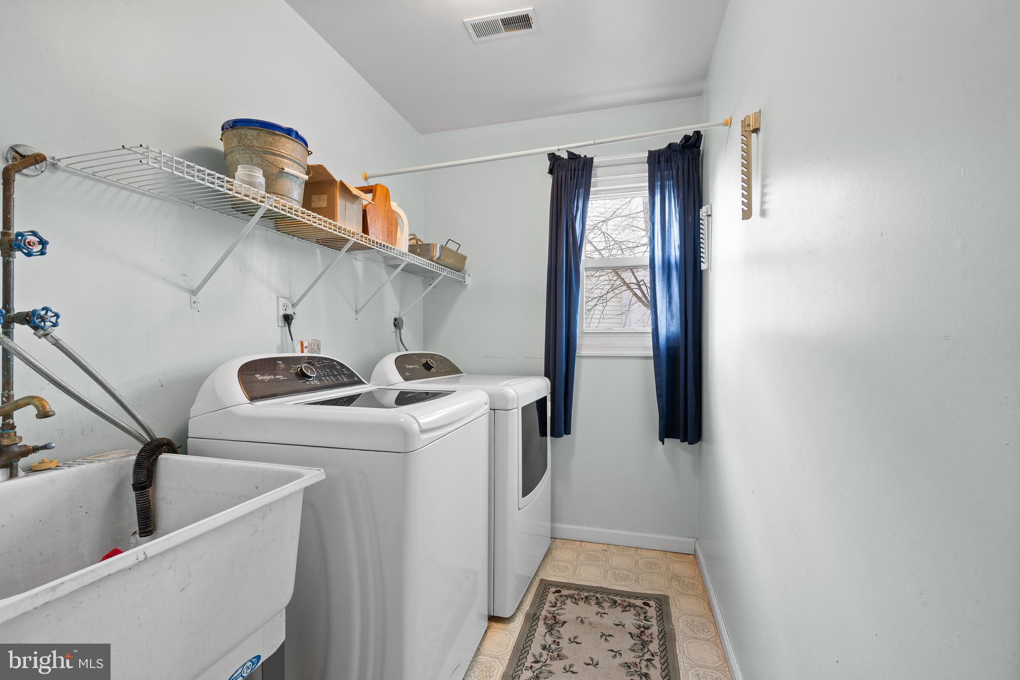 829 Alexander Drive Hatfield, PA 19440 - Photo 12 of 28 a view of storage and utility room with washer and dryer