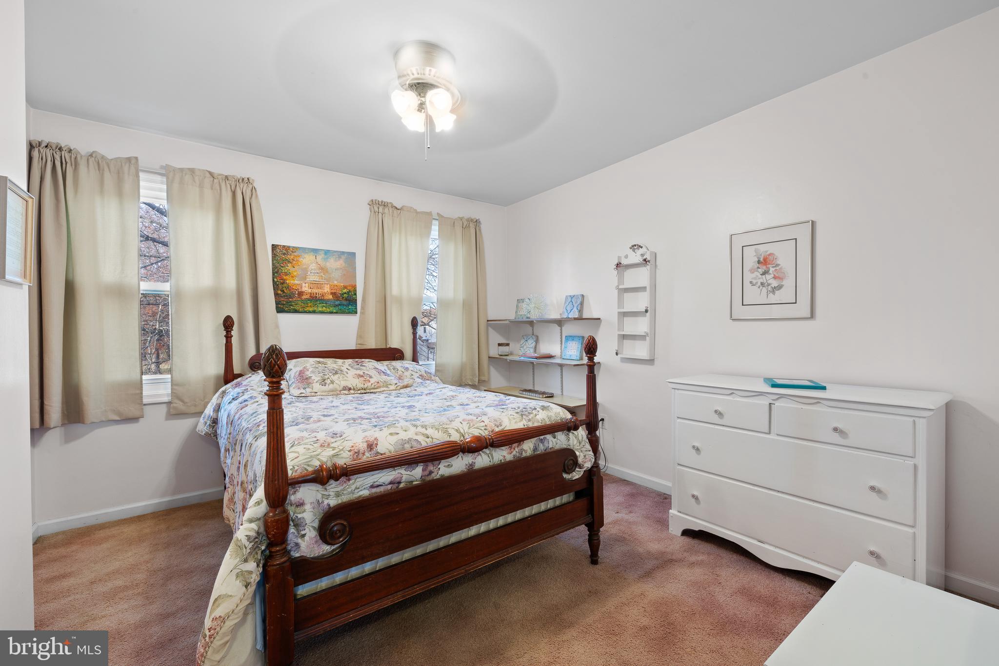 829 Alexander Drive Hatfield, PA 19440 - Photo 18 of 28 a bedroom with a bed and a chandelier