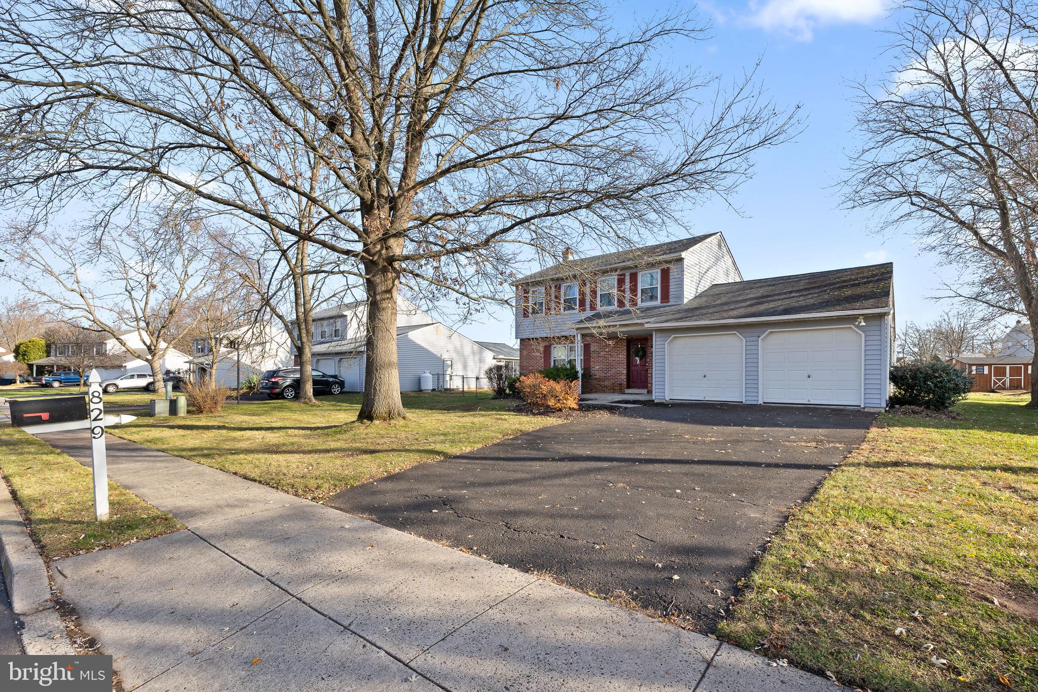 829 Alexander Drive Hatfield, PA 19440 - Photo 2 of 28 a view of a house with a large space and a large tree