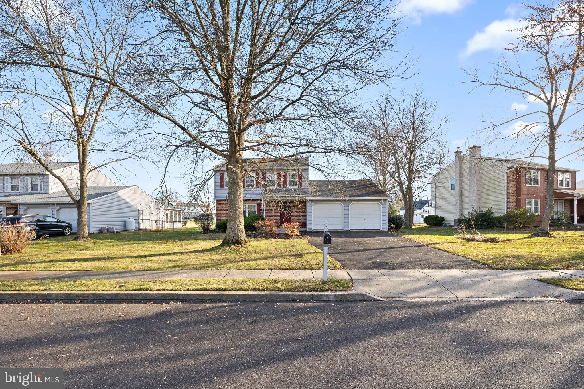 829 Alexander Drive Hatfield, PA 19440 - Photo 3 of 28 a view of a house with a large tree in front of it