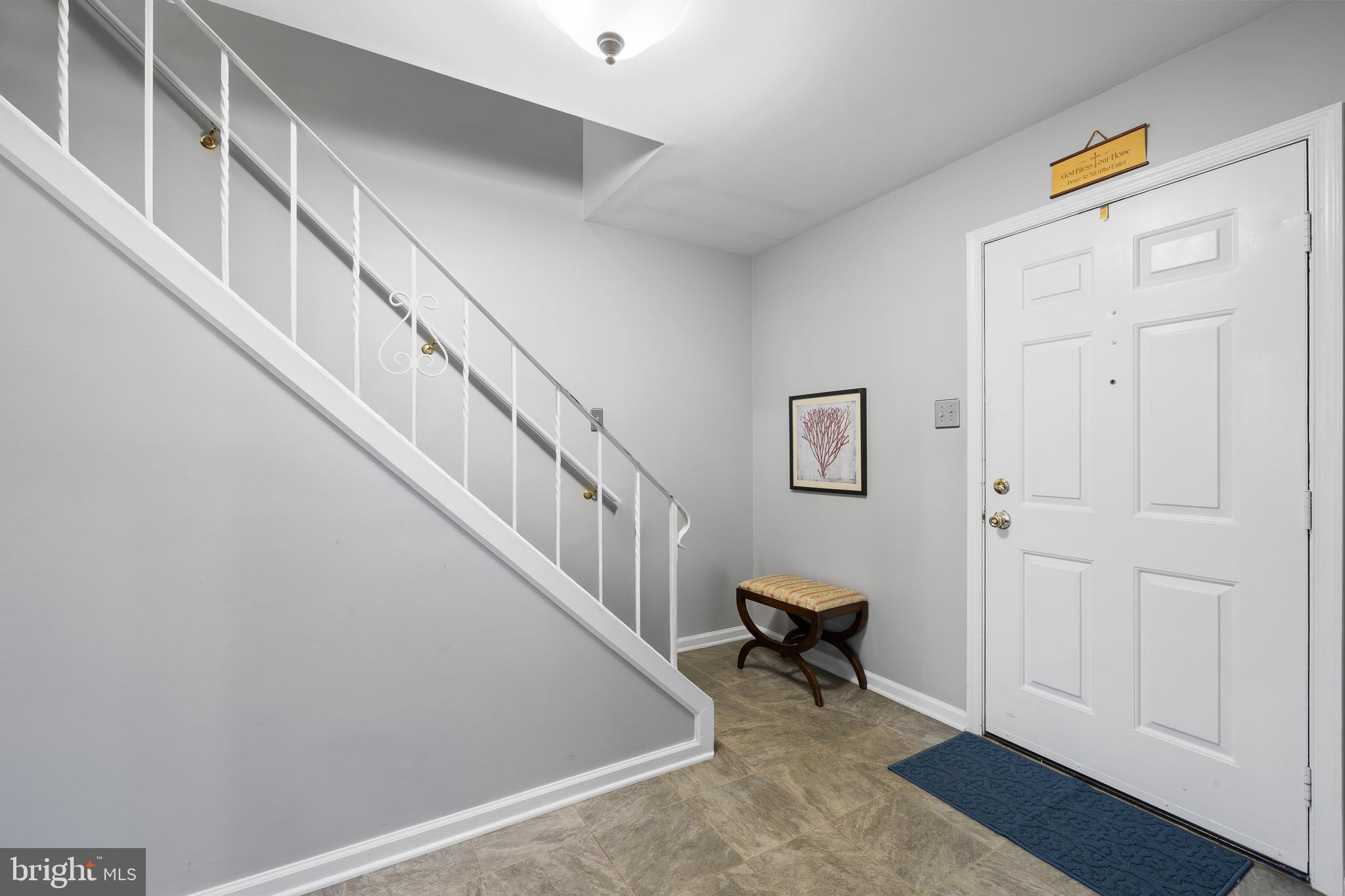 829 Alexander Drive Hatfield, PA 19440 - Photo 6 of 28 a view of a hallway with entryway wooden floor and windows
