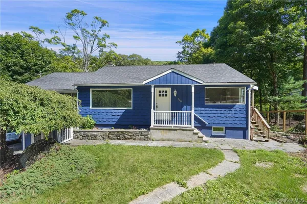 a house with trees in the background