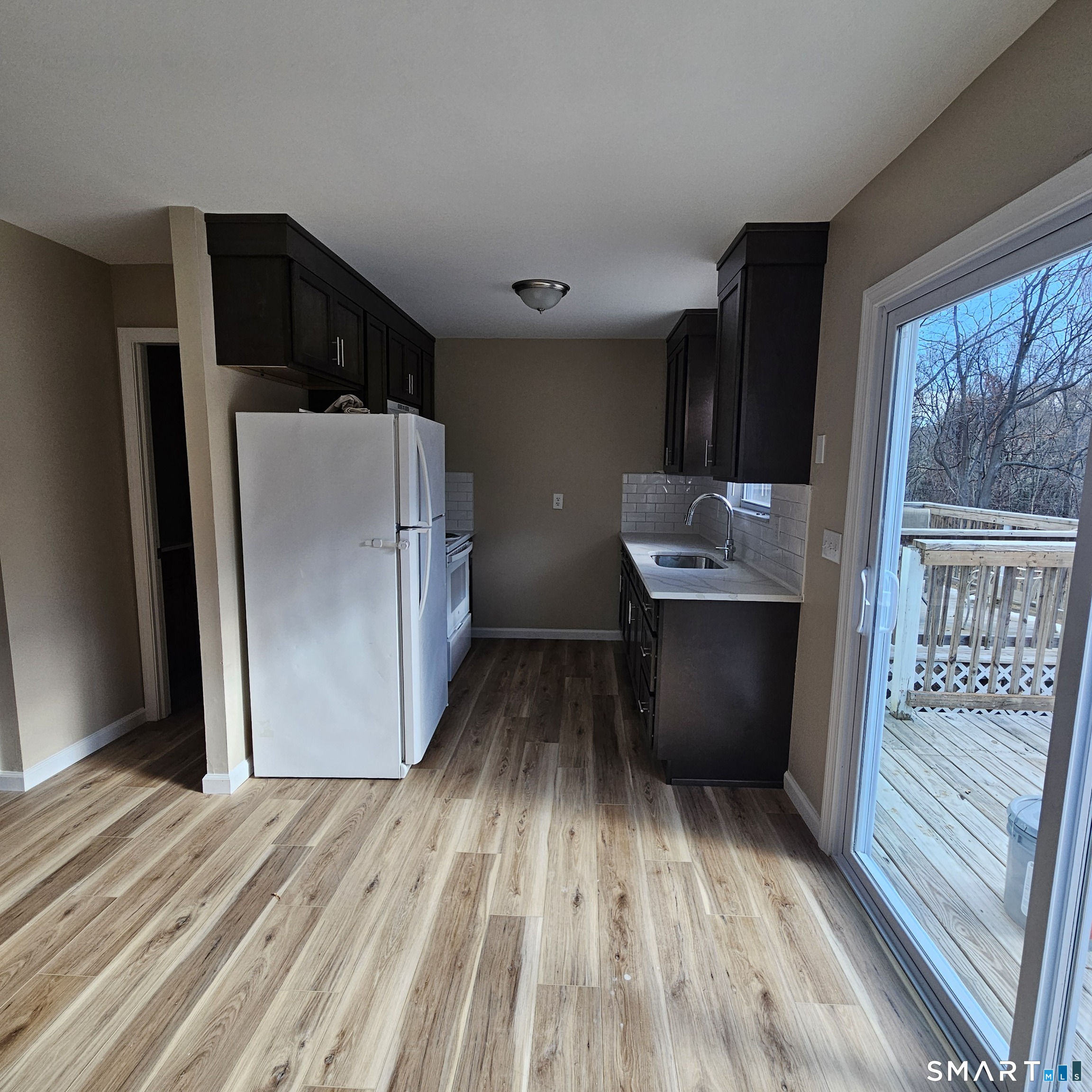 373 Wolcott Street Bristol, CT 06010 - Photo 11 of 23 a view of kitchen with furniture and wooden floor