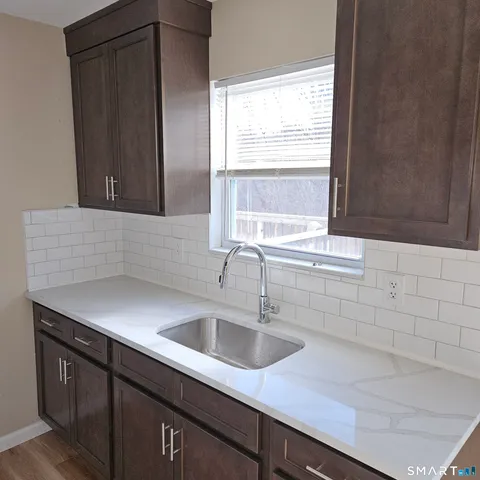 a kitchen with a sink and cabinets