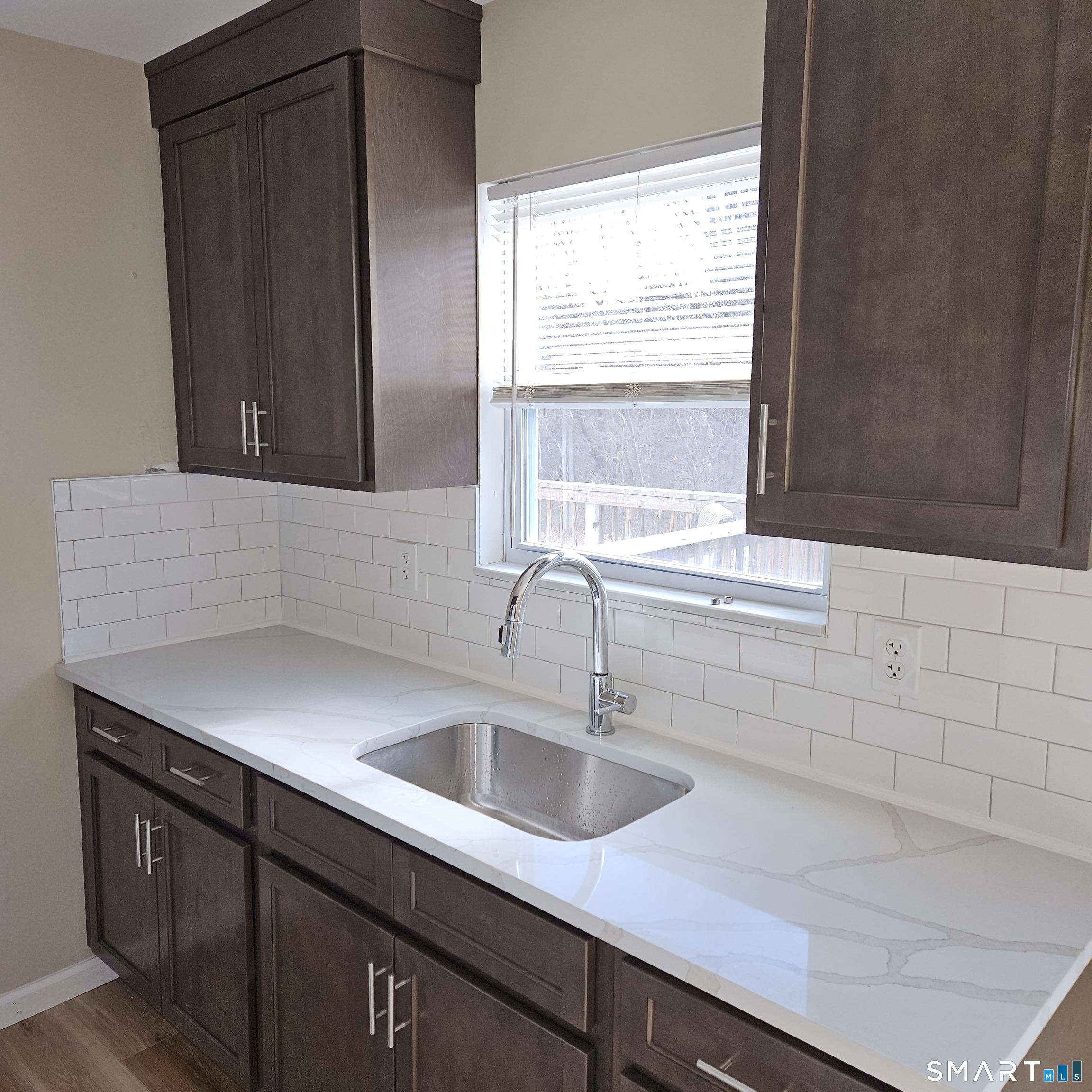 373 Wolcott Street Bristol, CT 06010 - Photo 13 of 23 a kitchen with a sink and cabinets