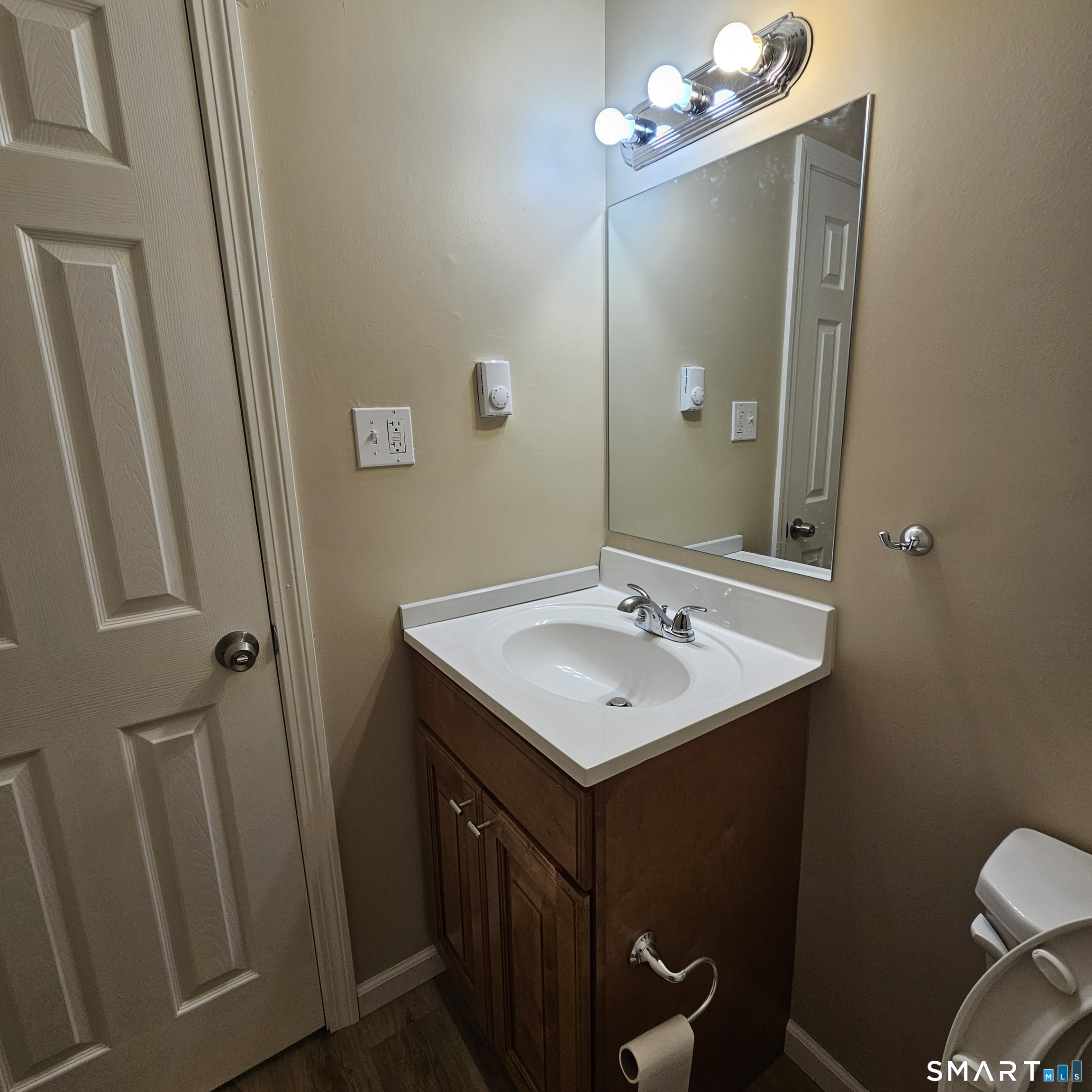 373 Wolcott Street Bristol, CT 06010 - Photo 18 of 23 a bathroom with a sink toilet and mirror