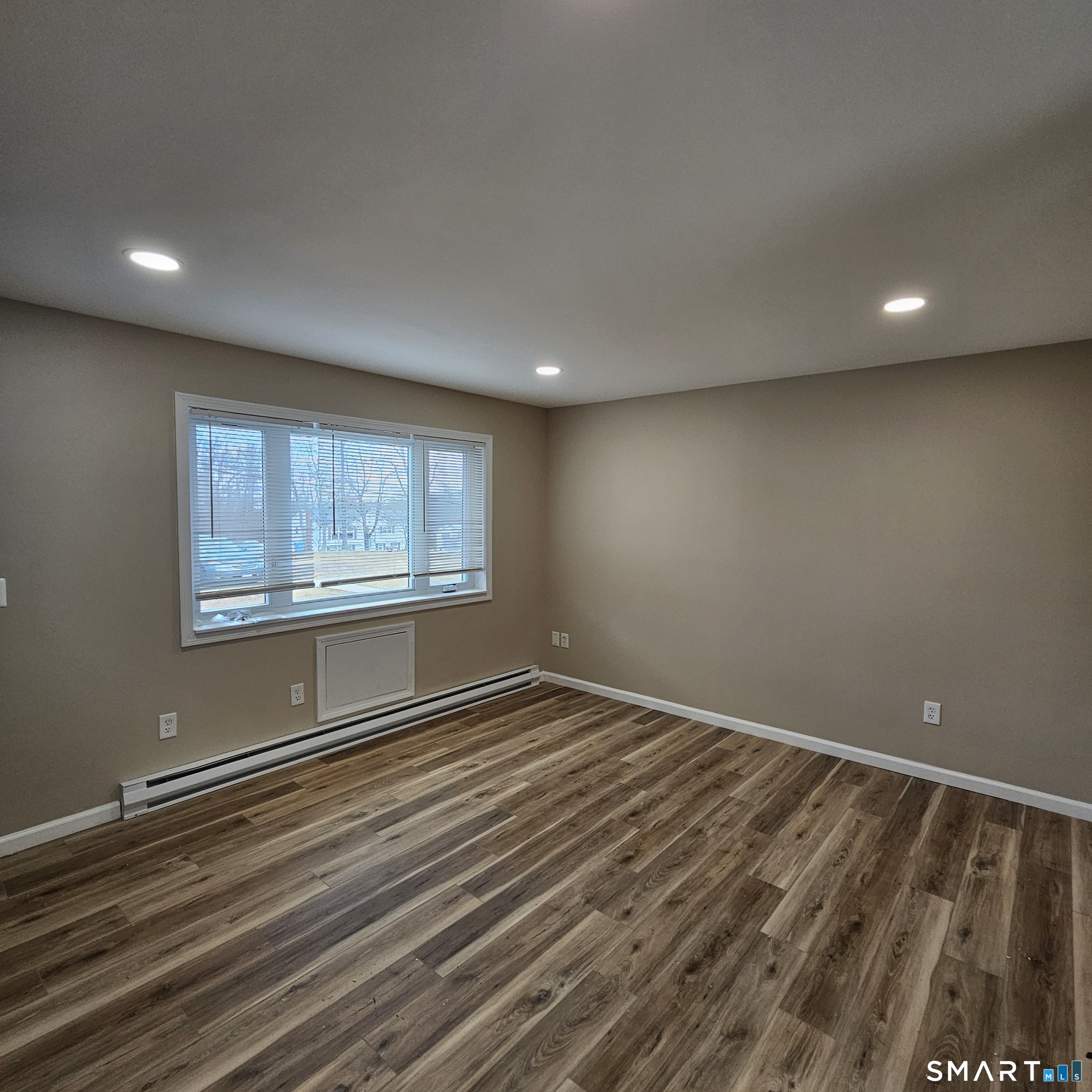 373 Wolcott Street Bristol, CT 06010 - Photo 20 of 23 a view of an empty room with a window