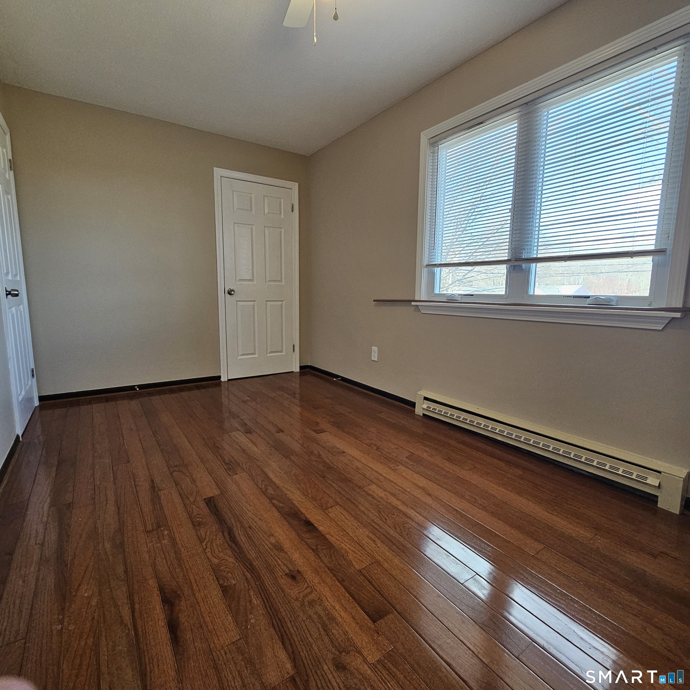 373 Wolcott Street Bristol, CT 06010 - Photo 3 of 23 a view of a room with wooden floor and window