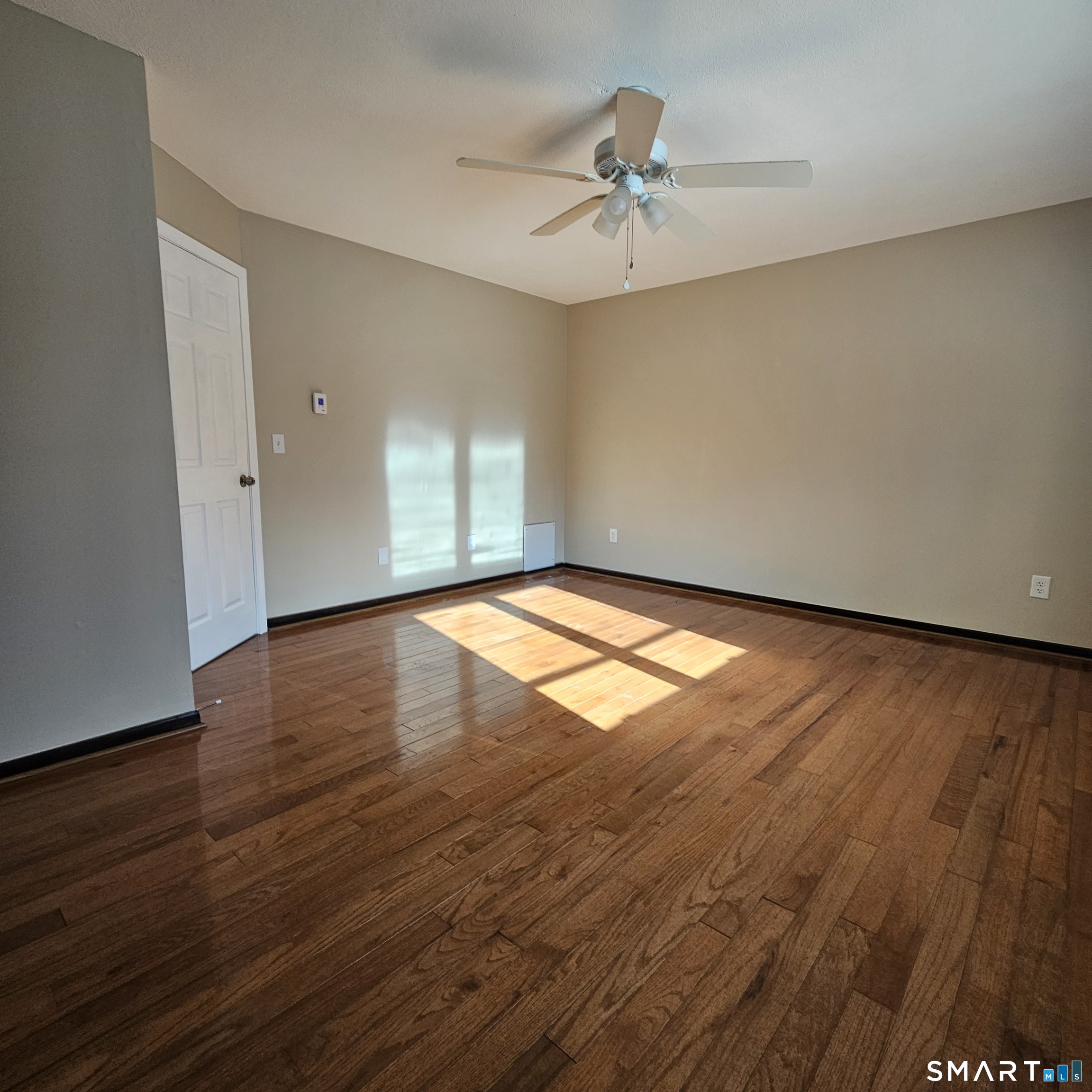 373 Wolcott Street Bristol, CT 06010 - Photo 8 of 23 a view of an empty room and wooden floor