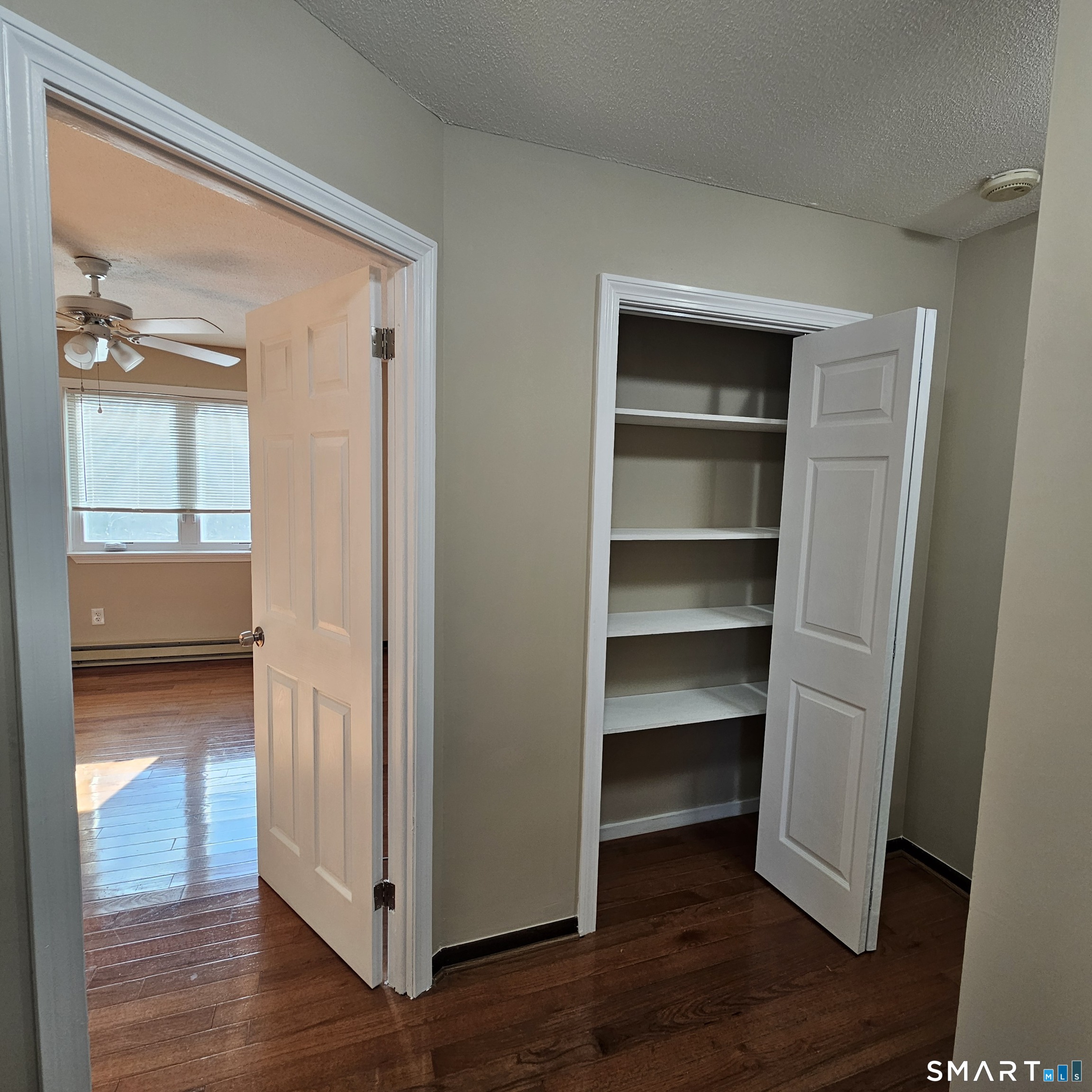 373 Wolcott Street Bristol, CT 06010 - Photo 10 of 23 a view of a room with wooden floor & closet