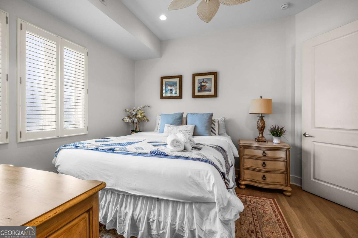 8 18th Street Tybee Island, GA 31328 - Photo 35 of 50 a bedroom with bed and a window