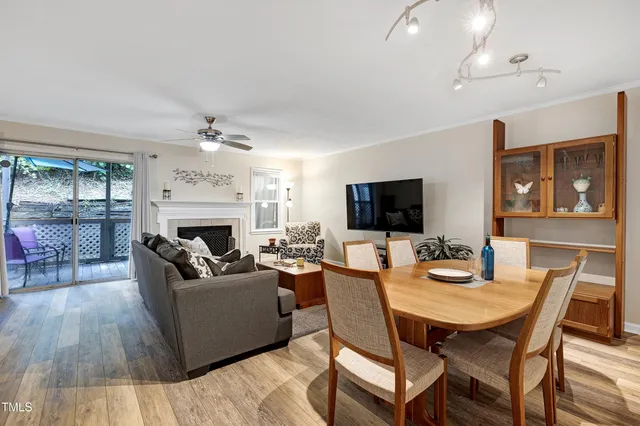 a living room with fireplace furniture and a flat screen tv