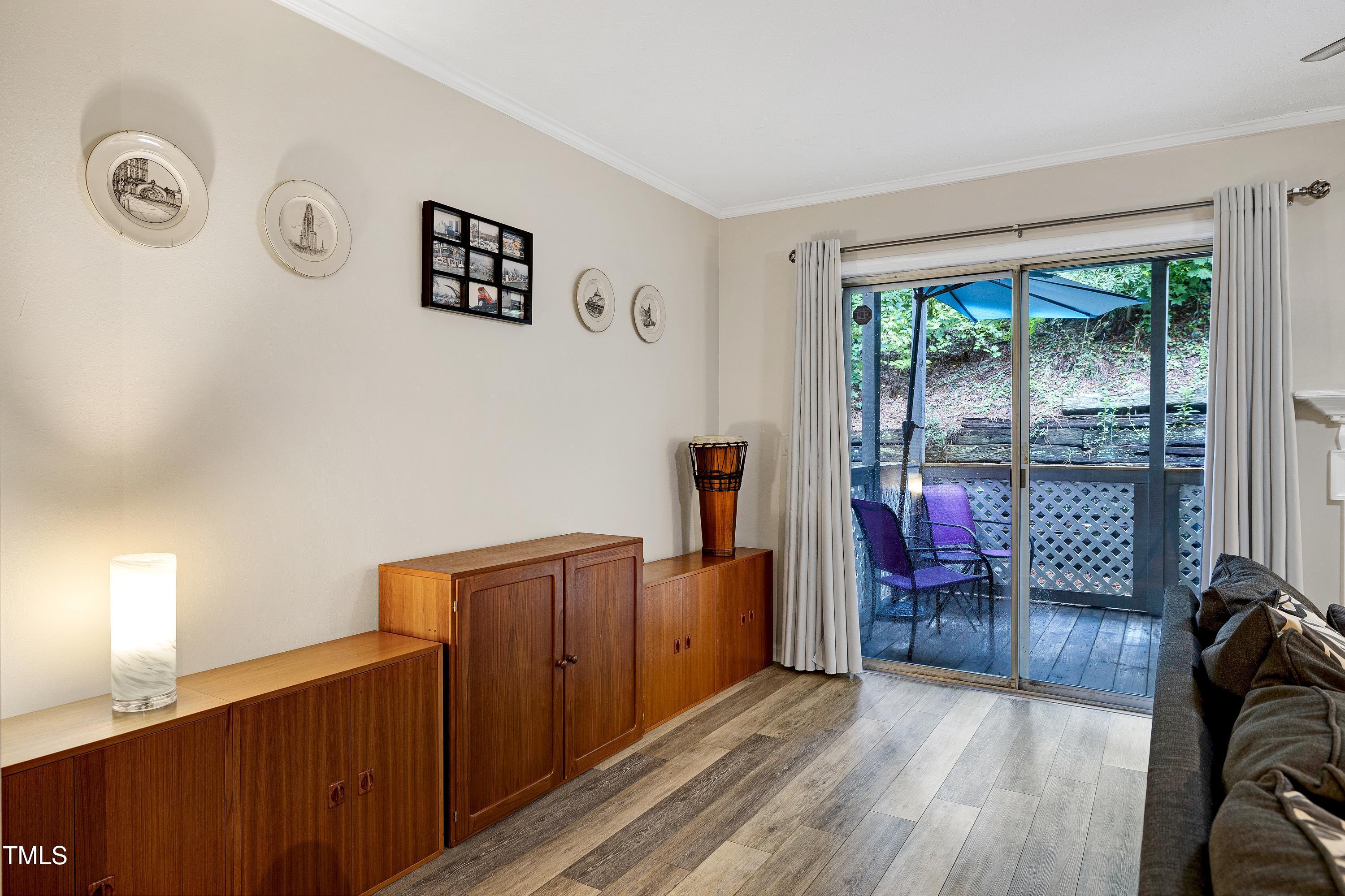 202 Oak Hollow Court Raleigh, NC 27613 - Photo 13 of 44 a view of a livingroom with furniture wooden floor and window
