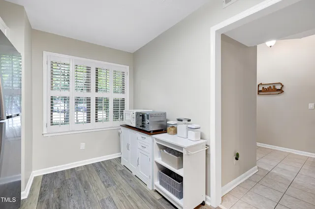 a kitchen with a refrigerator stove and sink