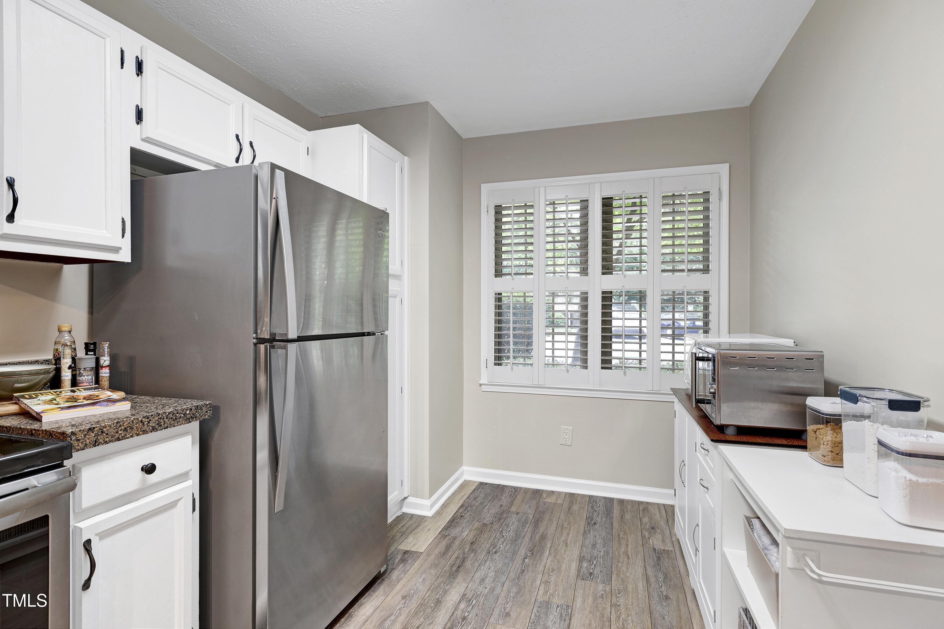 202 Oak Hollow Court Raleigh, NC 27613 - Photo 17 of 44 a kitchen with a refrigerator stove and sink