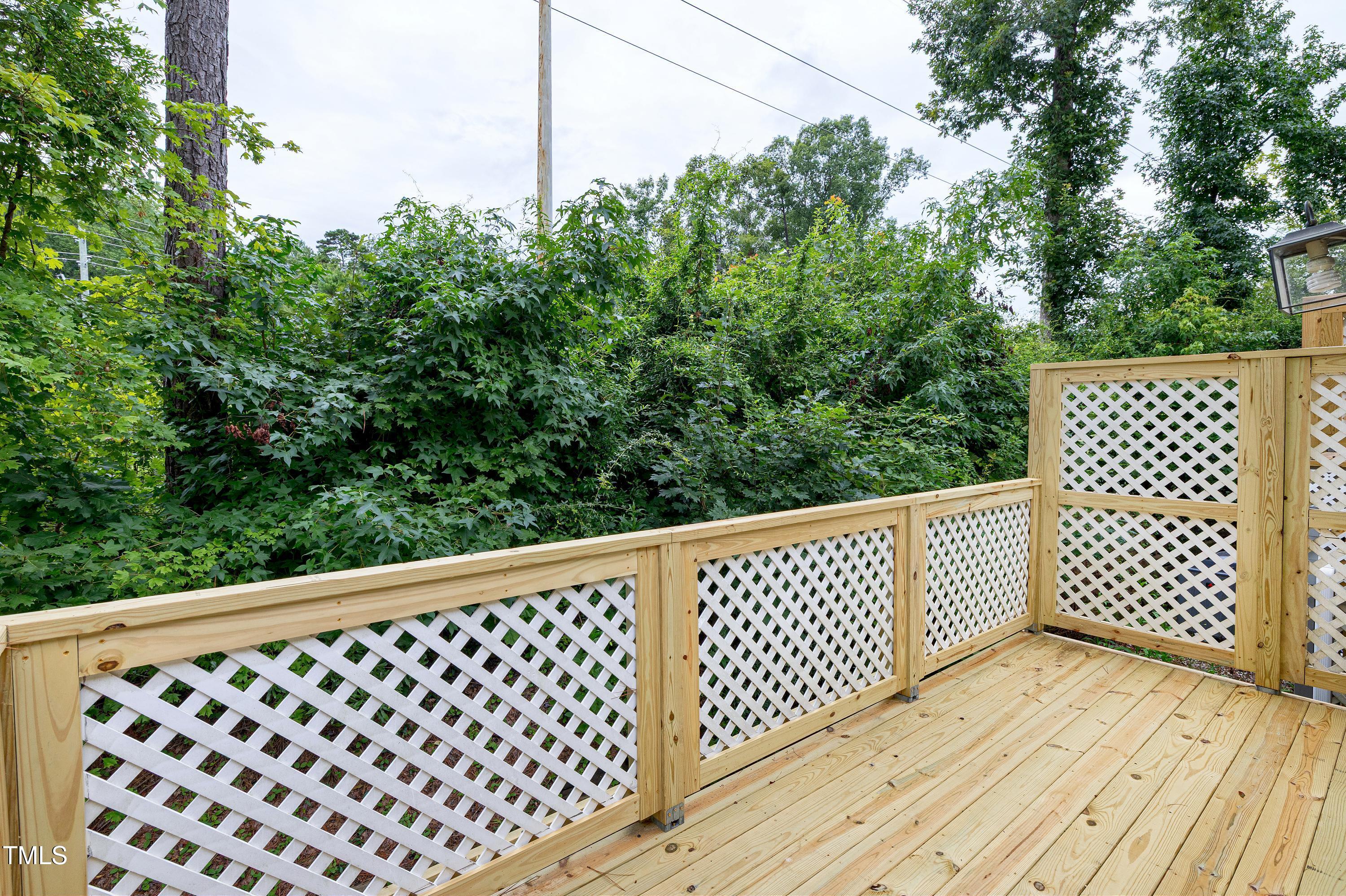 202 Oak Hollow Court Raleigh, NC 27613 - Photo 28 of 44 a wooden fence on the side of a building