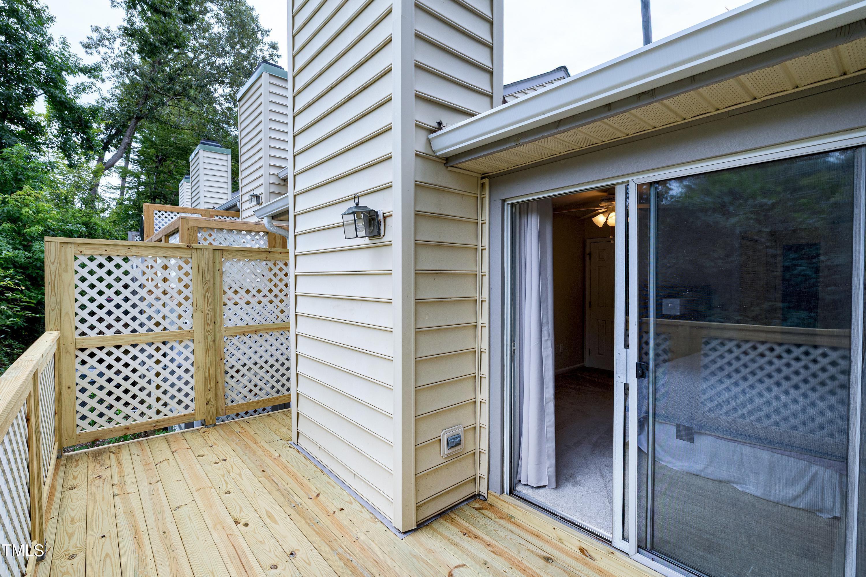 202 Oak Hollow Court Raleigh, NC 27613 - Photo 29 of 44 a view of a wooden house with a large window