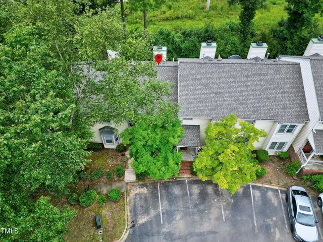 an aerial view of a house with outdoor space and street view