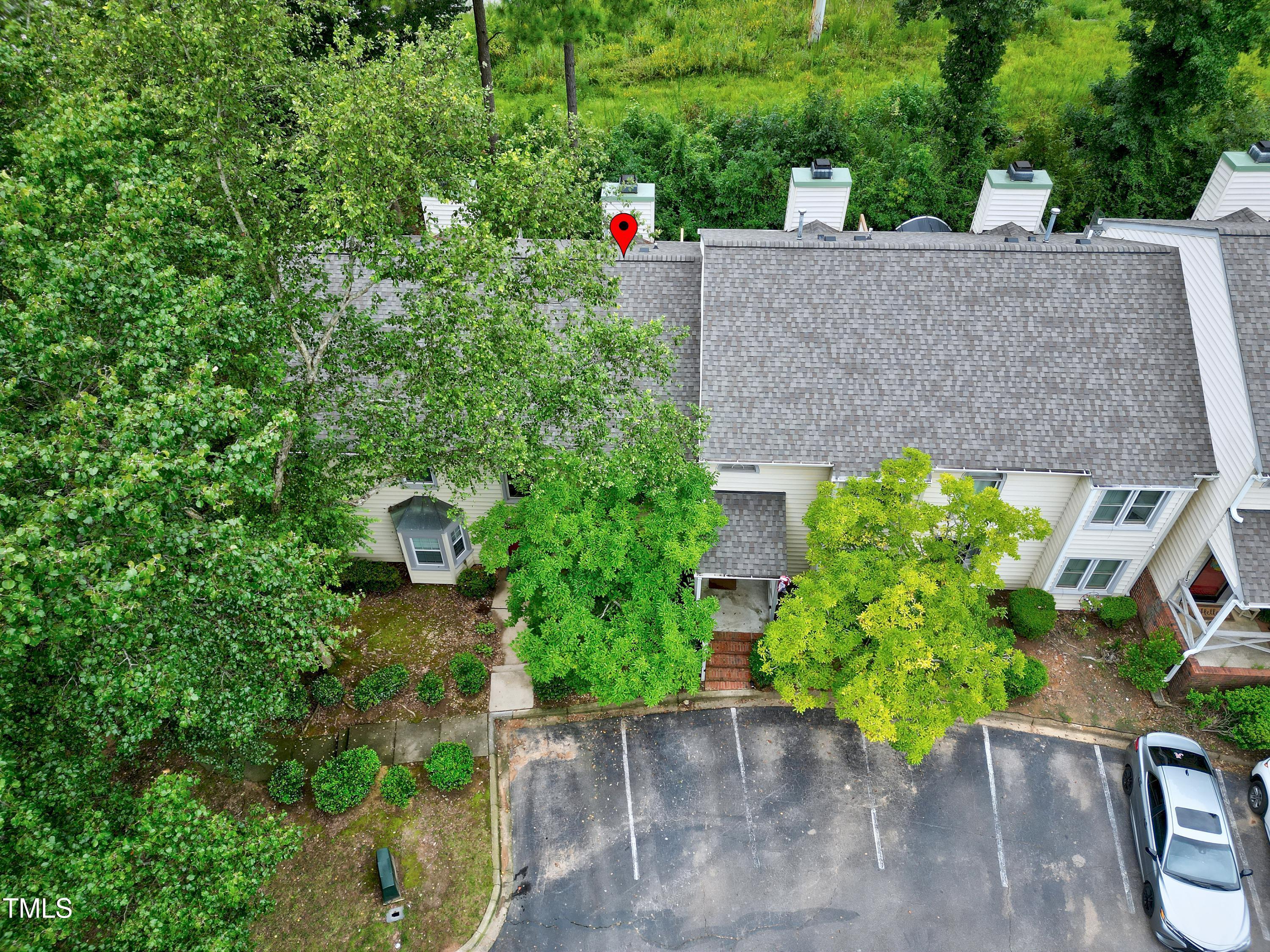202 Oak Hollow Court Raleigh, NC 27613 - Photo 37 of 44 an aerial view of a house with a yard and a large tree