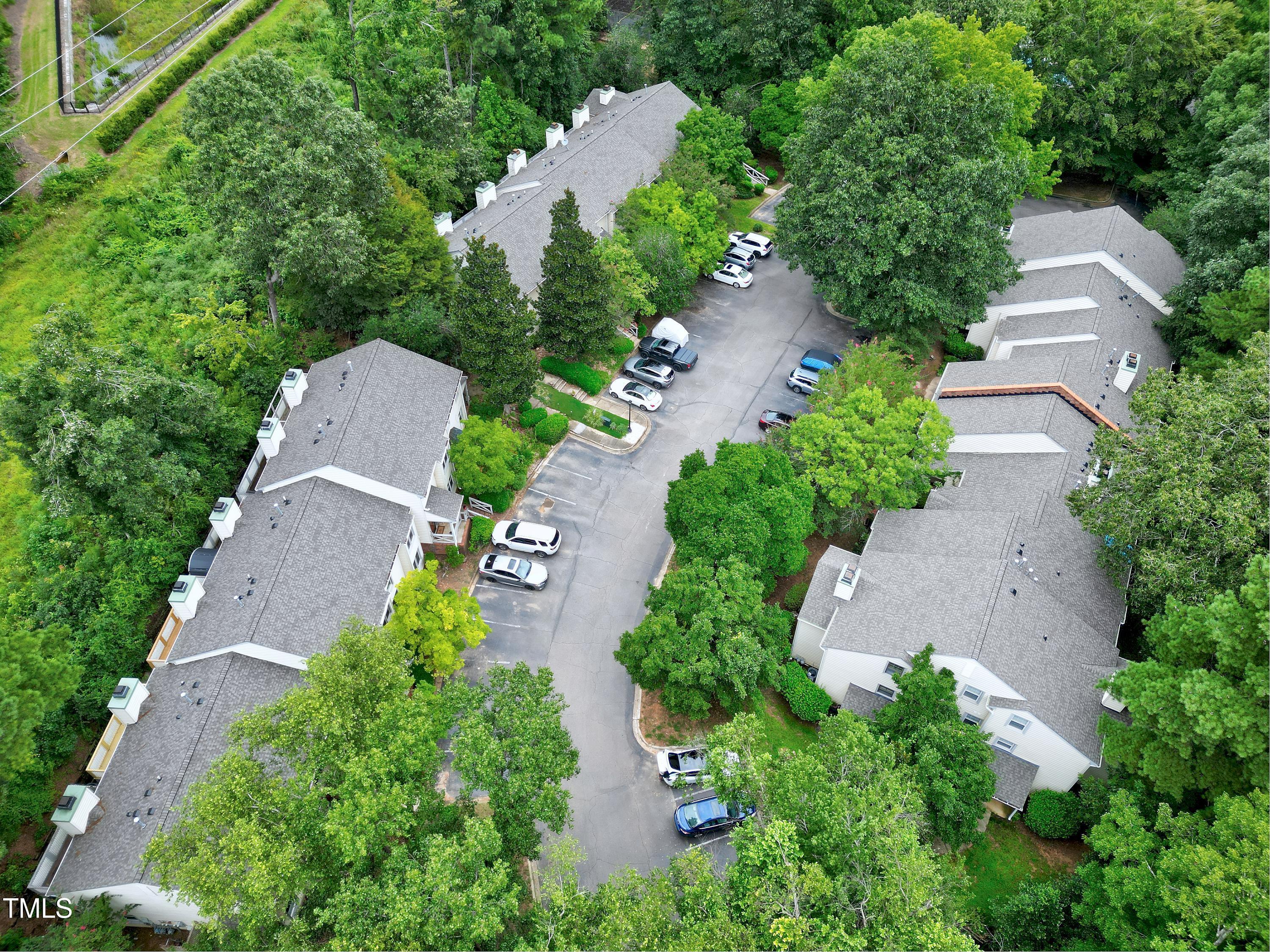 202 Oak Hollow Court Raleigh, NC 27613 - Photo 38 of 44 an aerial view of a house with outdoor space and street view