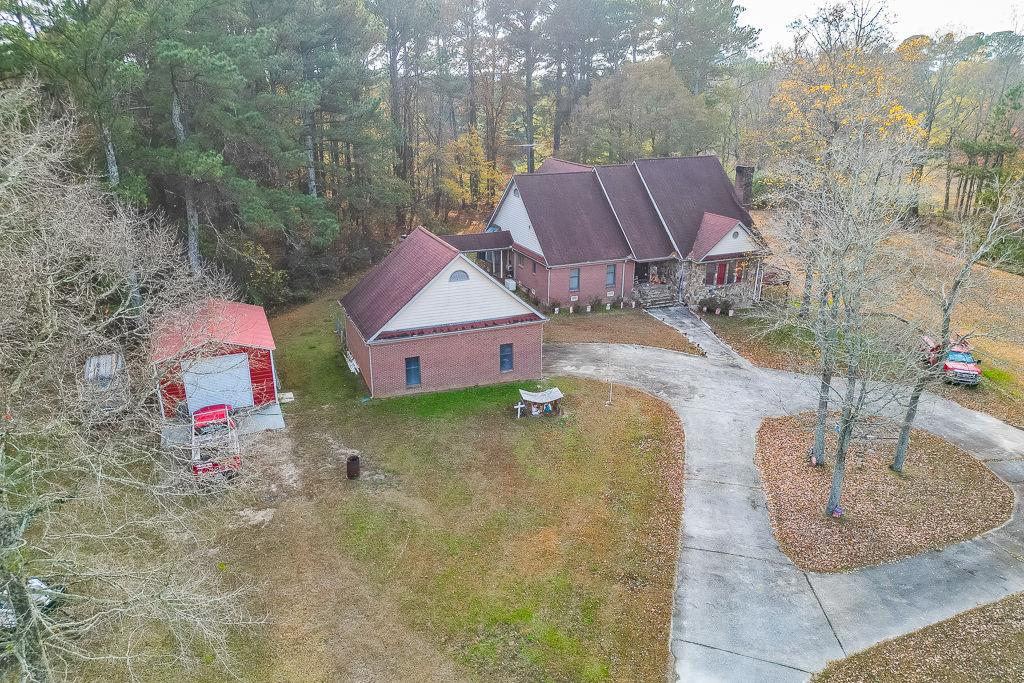 525 Cooper Road Loganville, GA 30052 - Photo 12 of 15 an aerial view of a house with swimming pool and large trees