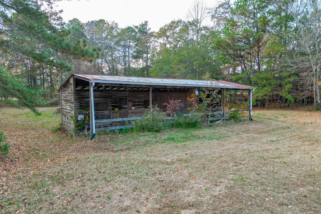 525 Cooper Road Loganville, GA 30052 - Photo 15 of 15 a view of a house with a backyard