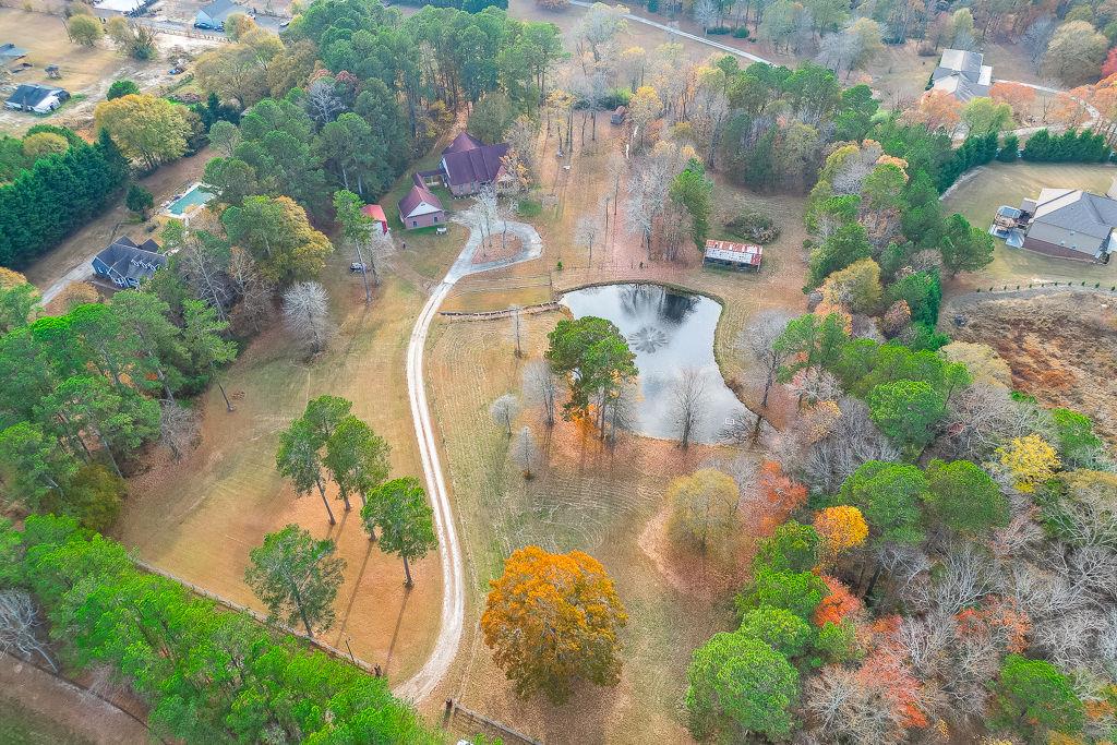 525 Cooper Road Loganville, GA 30052 - Photo 3 of 15 an aerial view of a house with a yard and lake view