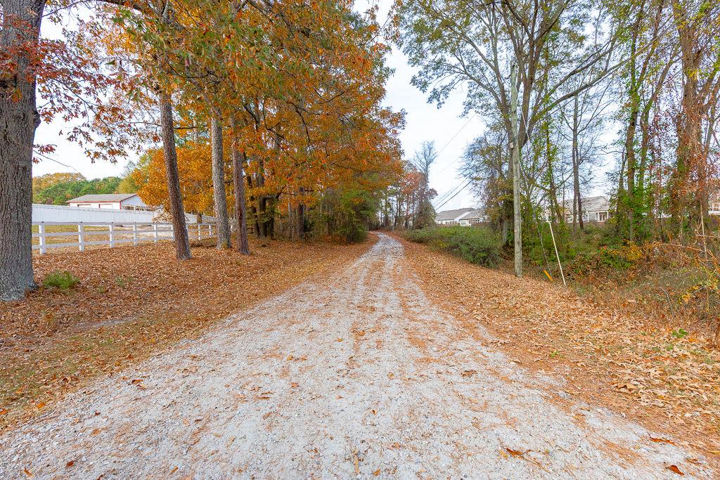 525 Cooper Road Loganville, GA 30052 - Photo 7 of 15 a view of a yard with wooden fence