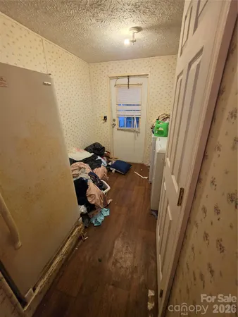 a kitchen with sink a refrigerator and a stove