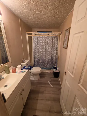 a living room with furniture a window and a flat screen tv