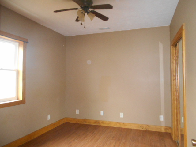 304 South Columbus Street Ransom, IL 60470 - Photo 9 of 24 an empty room with a window and a fan