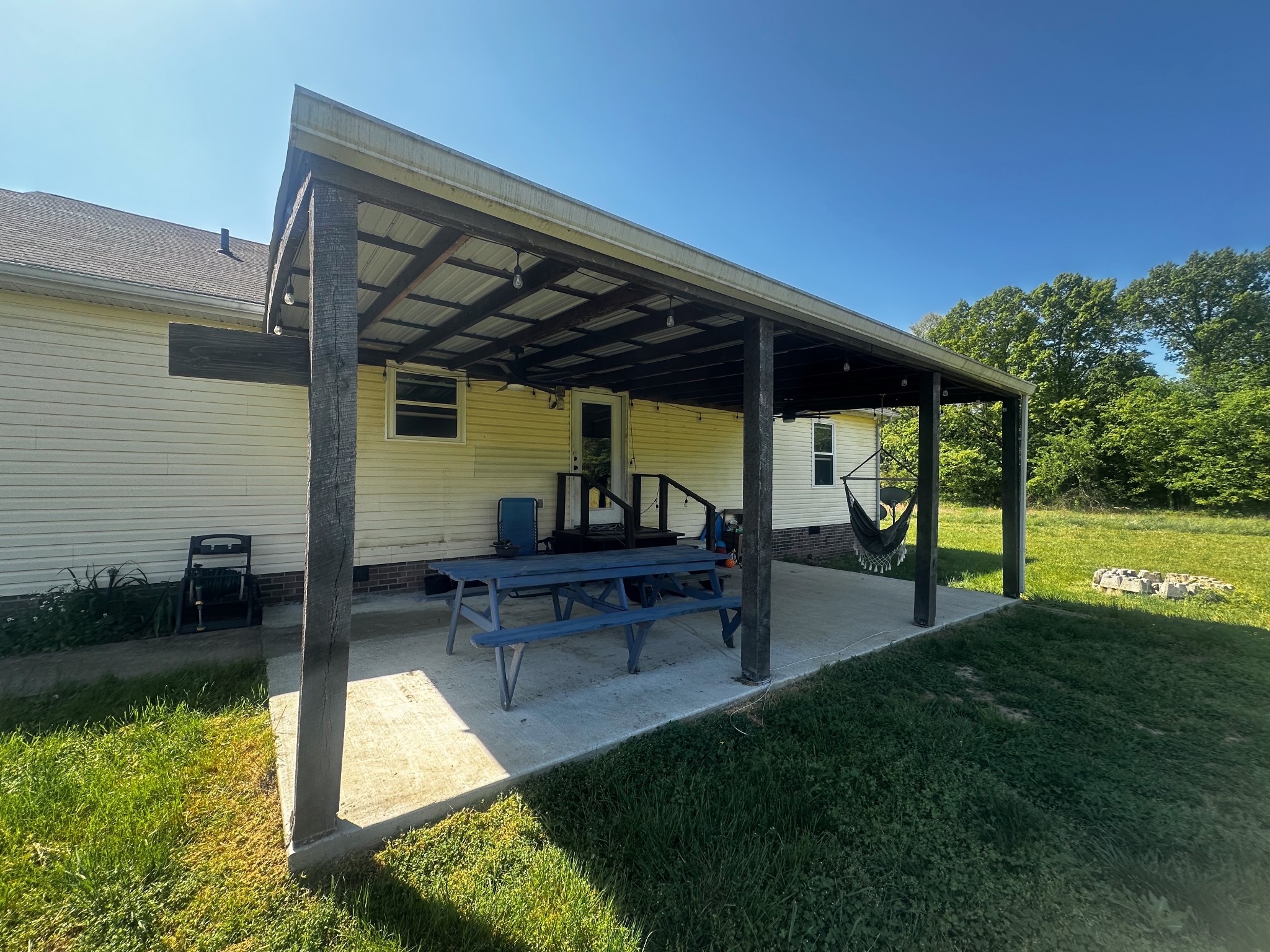 831 Philippi Road Wartrace, TN 37183 - Photo 15 of 51 a view of swimming pool with lawn chairs and a big yard