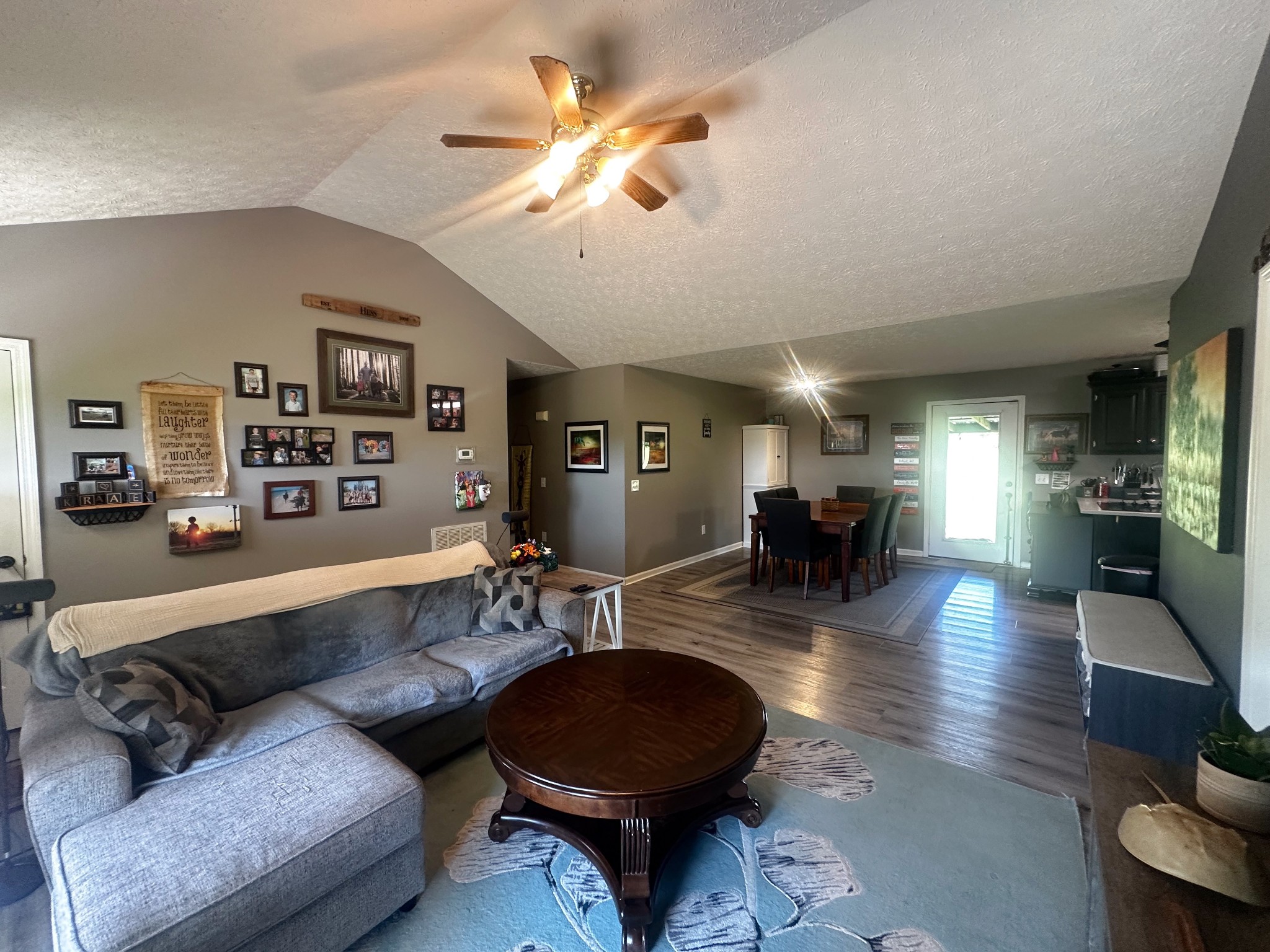 831 Philippi Road Wartrace, TN 37183 - Photo 19 of 51 a living room with furniture a ceiling fan and a rug