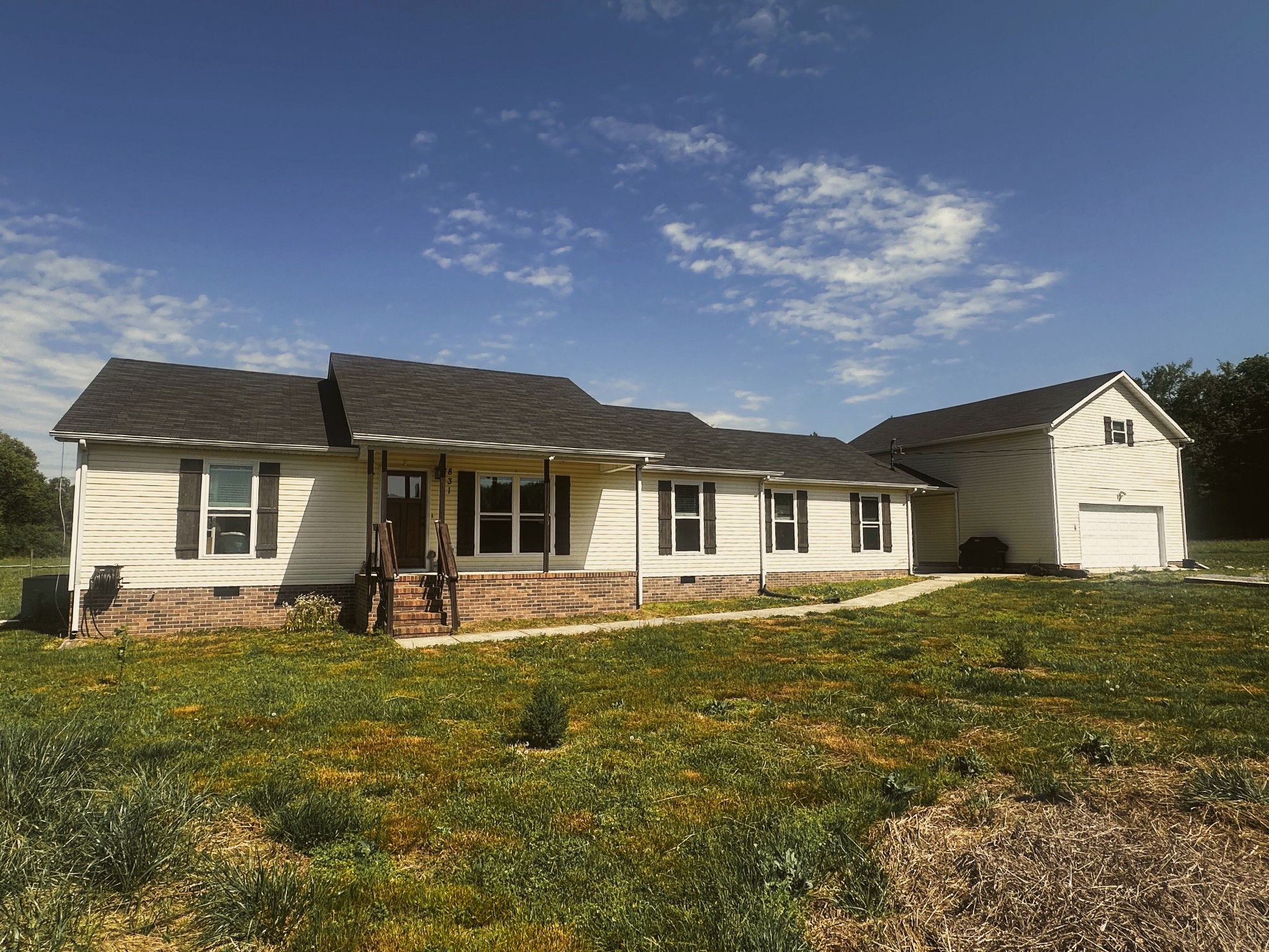831 Philippi Road Wartrace, TN 37183 - Photo 2 of 51 a front view of a house with a yard