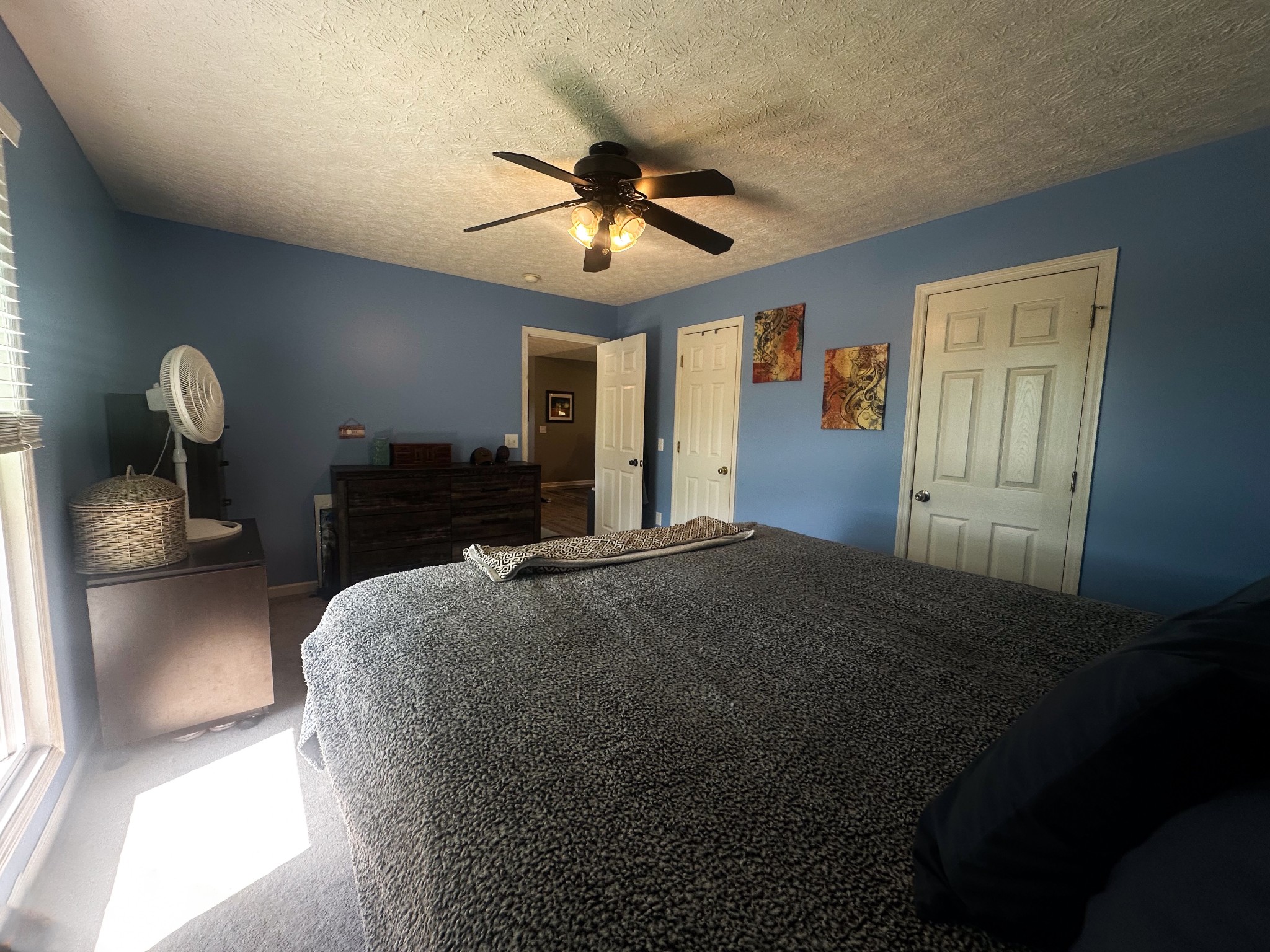 831 Philippi Road Wartrace, TN 37183 - Photo 36 of 51 a bed room with a bed and a chandelier